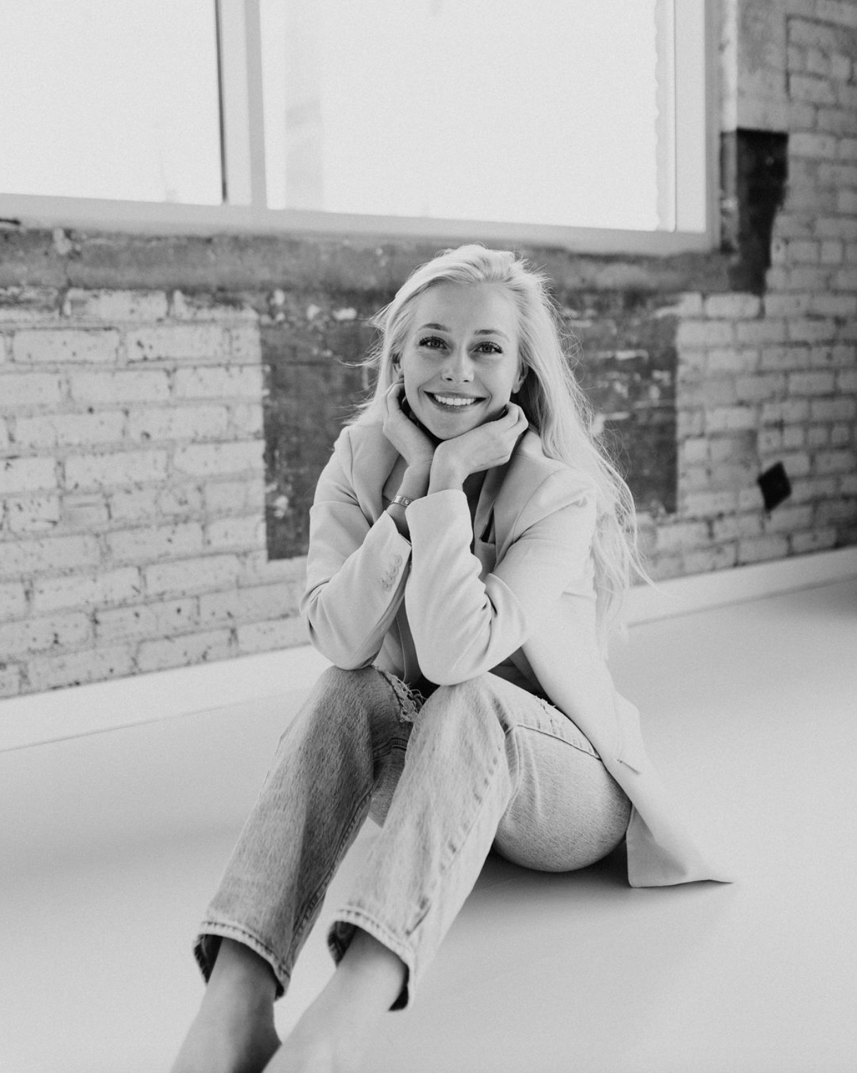 Botox Services in Bismark ND offered by Hannah Juma - Pictured here sitting down. 