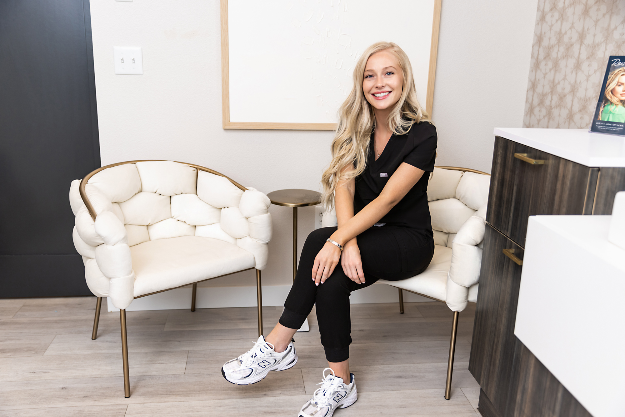 Hannah Boyko sitting on a chair in her office at HBBeauty in Bismark ND