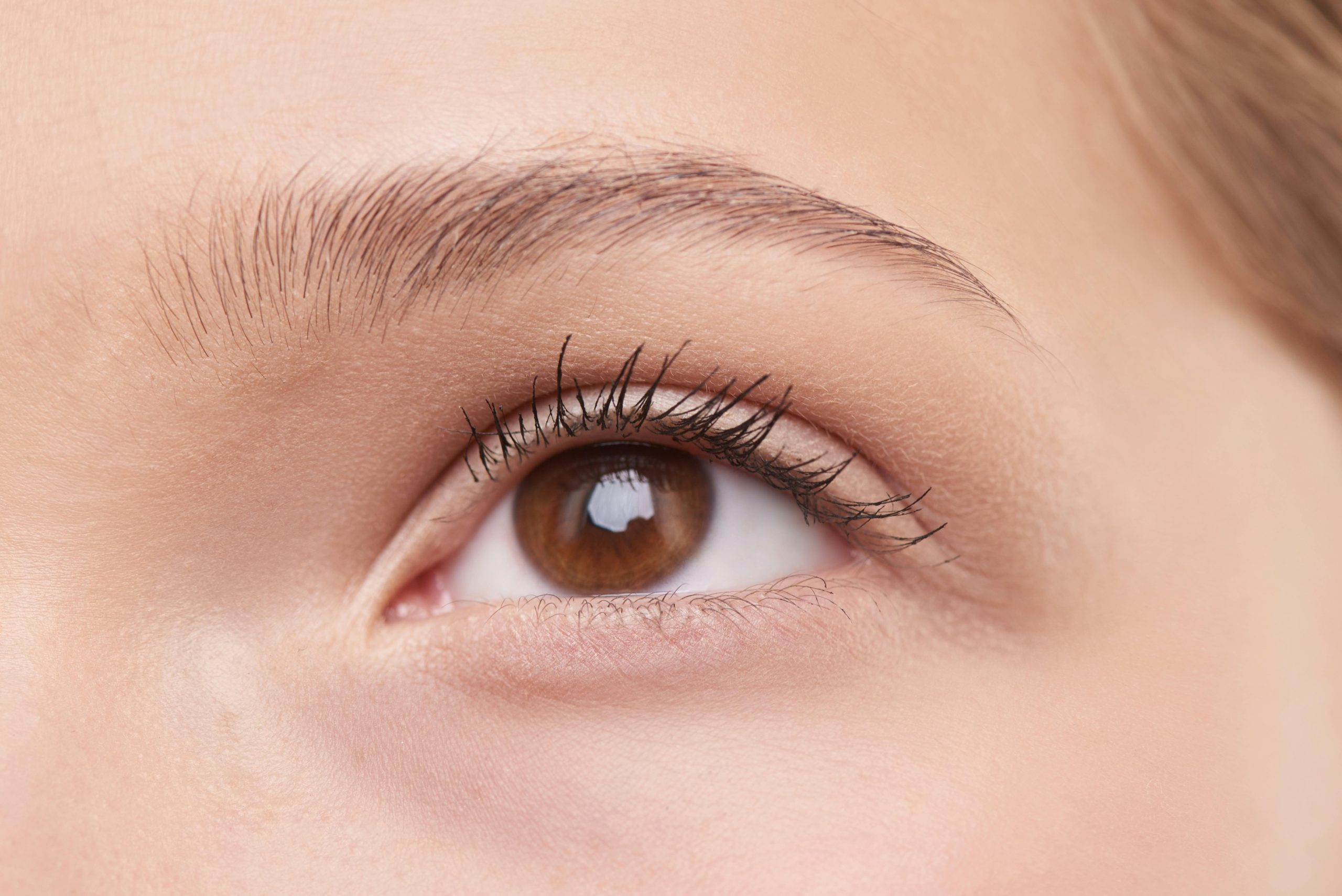 Closeup view of a woman's face after receiving a hydrafacial at HB Beauty. 